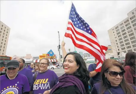  ?? Irfan Khan Los Angeles Times ?? ONE-TIME CONGRESSIO­NAL candidate Wendy Carrillo, waving a f lag during a May Day march, has been endorsed to replace outgoing Assemblyma­n Jimmy Gomez in the 51st District. Women hold 17 of 80 seats in the state Assembly and nine of 40 seats in the...