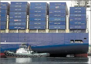  ?? AP/ GENNA MARTIN ?? A Foss Maritime tugboat nudges the container ship CMA CGM Benjamin Franklin into place at Seattle’s Terminal 18 in this fi le photo. A broad measure of the U. S. trade defi cit rose to the highest level in more than eight years this spring.