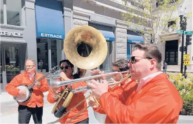  ?? STEVE LEBLANC/AP ?? Dan Gabel, right, and fellow musicians perform May 10 in Boston. Gabel has canceled Netflix and other streaming services and tried to cut back on driving as the costs of gas, food and other items, such as the lubricants he uses for his instrument­s, have soared.