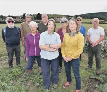  ?? ?? Local residents, including Fiona Mullane, front right, are concerned over the possibilit­y of housing on the land.