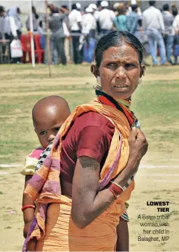  ?? ?? LOWEST TIER A Baiga tribal woman with her child in Balaghat, MP