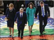  ?? JOSHUA A. BICKEL/THE COLUMBUS DISPATCH ?? First lady Fran DeWine (from left), Ohio Gov. Mike DeWine, Tina Husted and Ohio Lt. Gov. Jon Husted on stage at their ceremonial swearing-in at the Statehouse on Monday.