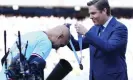  ?? Photograph: Javier García/Shuttersto­ck ?? Richard Masters presents Pep Guardiola with his winners’ medal after Manchester City clinch the Premier League title in May.