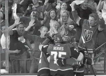  ?? The Associated Press ?? MARRIAGE IN VEGAS: Left wing Tomas Nosek, left, celebrates with teammates after scoring on May 18 during the Golden Knights’ 3-2 win over the Winnipeg Jets in Game 4 of the NHL Western Conference finals in Las Vegas. The love affair between a city and...