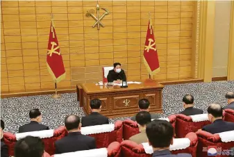  ?? / Korean Central News Agency ?? North Korean leader Kim Jong Un attends a meeting on antivirus strategies in the capital, Pyongyang. There have been 62 deaths and more than 1.7 million fever cases since late April.