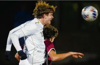  ?? GLENN OSMUNDSON FOR THE GLOBE ?? Needham’s Kyle Reddish uses his head in the Division 1 state soccer final.