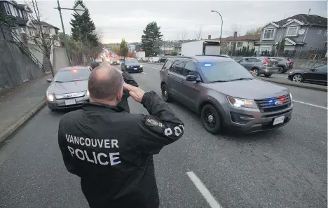  ?? JASON PAYNE/PNG ?? First-responders line Grandview Highway in Vancouver on Thursday to pay their respects to Abbotsford police Const. John Davidson, whose body was returned under police escort to Abbotsford in advance of his funeral on Nov. 19. He was shot to death...