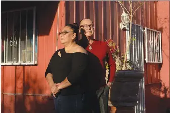  ??  ?? Guadalupe Rodriguez, left, moved in with Bobby Hernandez, a co-worker who was laid off, and another roommate last year. The three Las Vegans are still struggling to pay bills.