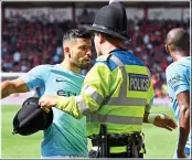  ??  ?? CLASH: Sergio Aguero has been accused of hitting a steward, but pictures and video from the incident appear to show him expressing concern for the welfare of a fan following Raheem Sterling’s 97th-minute winner.