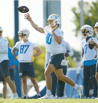  ?? ASHLEY LANDIS/AP ?? As he prepares for this season, Chargers Pro Bowl QB Justin Herbert has placed an emphasis on improving his footwork.