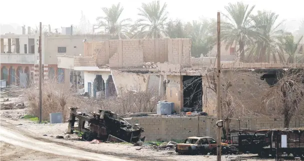  ?? — AFP photo ?? This picture shows destructio­ns during an operation to expel Islamic State group (IS) jihadists from their last bastion, in Baghouz.