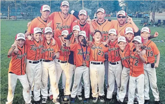  ?? SUBMITTED PHOTO ?? Members of the AAA Ontario champion Peterborou­gh Major Rookie Tigers include: (front l-r) Thomas Dalliday, Ayden Turner, Jack Philips, Brett Crowley, Beau Marshall, Tyler Crawford, Noah Stanley, Jack Hatton, Lucas Cavanagh, Cole Cavanagh, Garrett Jones, Lincoln Rose; (back l-r) Dave Dalliday (assistant coach), Matt Philips (assistant coach), Adam Crowley (head coach), Craig Stanley (assistant coach) and Noah Crowley (assistant coach).