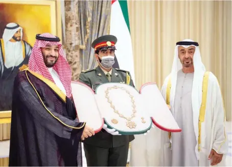  ?? Supplied ?? Abu Dhabi’s Crown Prince Mohammed bin Zayed Al-Nahyan presents to Saudi Crown Prince Mohammed bin Salman the Order of Zayed, the UAE’s highest civilian award, on Tuesday. The Saudi crown prince arrived in Abu Dhabi, the UAE’s capital, on the second leg of his Gulf tour.