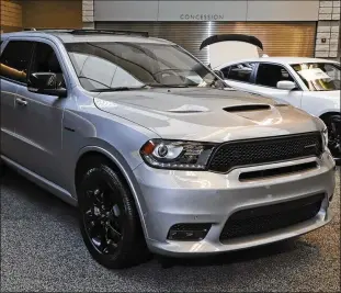  ?? GENE J. PUSKAR / AP ?? Fiat Chrysler, maker of this Dodge Durango R/T Blacktop AWD on display at the 2020 Pittsburgh Internatio­nal Auto Show, tied with Kia for first place in the vehicle quality survey.