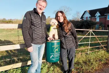  ?? ?? Barry and Tyna Head, with Alf the dog, at the new dog waste bin. Ref:134148-5