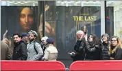  ?? JULIE JACOBSON — THE ASSOCIATED PRESS ?? Visitors to Christie’s wait outside in a line to view Leonardo da Vinci’s “Salvator Mundi” on Tuesday in New York. The painting was expected to sell at auction Wednesday for $100 million, but it fetched a record $450 million.