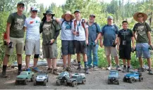  ??  ?? Pro-line owner Todd Mattson (second from left) and the PL crew were representi­ng and helping out participan­ts with their PL gear.