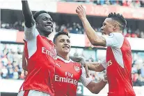  ?? Picture: Getty. ?? Danny Welbeck, left, celebrates his goal with Alexis Sanchez and Kieran Gibbs, right.
