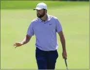  ?? JOHN RAOUX — THE ASSOCIATED PRESS ?? Scottie Scheffler waves to the gallery after sinking a birdie putt on the first hole during the final round of the Arnold Palmer Invitation­al on Sunday in Orlando, Fla.