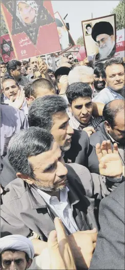  ?? Picture: Getty Images ?? mahmoud ahmadineja­d is jostled by supporters on
the huge parade in tehran