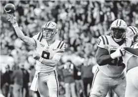  ?? Vasha Hunt / Associated Press ?? LSU quarterbac­k Joe Burrow (9) and the Tigers could usurp Ohio State for the top spot in the next College Football Playoff rankings.