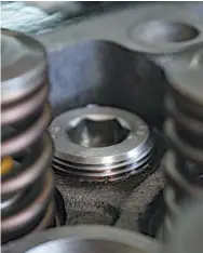  ??  ?? In high-horsepower applicatio­ns and sometimes due to age, the traditiona­l, press-in freeze plugs can fall out of the factory head. When they do, coolant disappears and quickly mixes with engine oil. By machining all 11 internal freeze plug bores to accept threaded, screw-in style freeze plugs, Scheid rules out this notorious failure from ever occurring in the future.