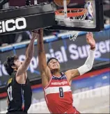  ?? Kathy Willens / Associated Press ?? Wizards forward Rui Hachimura shoots against Nets forward Joe Harris.