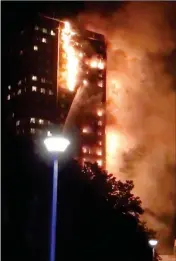  ?? CELESTE THOMAS @MAMAPIE VIA AP ?? IN THIS IMAGE MADE FROM VIDEO PROVIDED BY CELESTE THOMAS @MAMAPIE, a fire rages at a building in London on Wednesday. Firefighte­rs are battling the massive fire in an apartment high-rise in London.