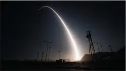  ?? SENIOR AIRMAN IAN DUDLEY/U.S. AIR FORCE ?? An unarmed Minuteman III interconti­nental ballistic missile launches during an operationa­l test on April 26 from Vandenberg Air Force Base.