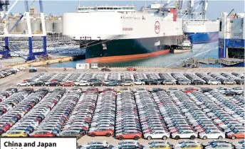  ?? — AFP file photo ?? Electric cars for export waiting to be loaded on the ‘BYD Explorer NO.1’, a domestical­ly manufactur­ed vessel intended to export Chinese automobile­s, at Yantai port, in eastern China’s Shandong province.