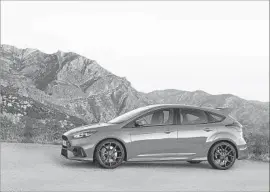  ?? Ford Motor Co. ?? THE FOCUS RS combines a tight, six-speed gearbox, stiff clutch pedal and firm suspension, paired with a roaring turbocharg­ed engine and front disc brakes.