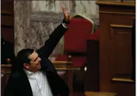  ?? AP/THANASSIS STAVRAKIS ?? Greek Prime Minister Alexis Tsipras votes on Macedonia issues Friday in Athens.