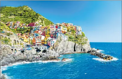  ??  ?? BRIGHT STUFF: You could see Manarola’s colourful houses in Liguria, Italy, during a European cruise