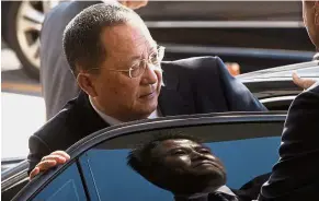  ??  ?? AP
Not worried: Ri getting into a car at Beijing Capital Internatio­nal Airport. —