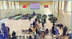  ?? PHOTOS PROVIDED TO CHINA DAILY ?? Left and right: Guazhou No 2 Middle School provides free accommodat­ions for travelers stranded in Guazhou county, Gansu, last month. The school hosted more than 780 people who were caught in a snowstorm.