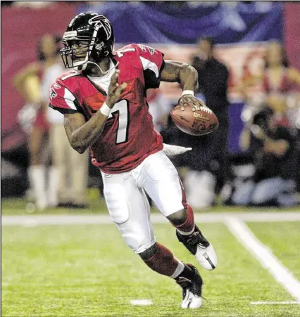  ?? AJC FILE ?? Michael Vick helped the Falcons win and attracted big crowds to the Georgia Dome, but it’s difficult to forget he wasn’t with the team when it needed him during a poor 2007 season.