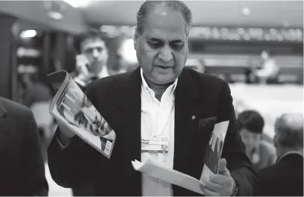 ??  ?? Bajaj, Indian billionair­e and chairman of Bajaj Auto Ltd., walks in the halls on the opening day of the World Economic Forum (WEF) in Davos, Switzerlan­d, on Jan 23, 2013. — WP-Bloomberg photo