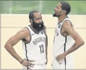  ?? JEFFREY PHELPS — THE ASSOCIATED PRESS ?? Brooklyn Nets teammates James Harden (13) and Kevin Durant may both be on the U.S. Olympic team in Tokyo.
