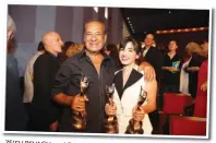  ?? (Itzick Biran) ?? ZE’EV REVACH and Dana Ivgy at the 2014 Ophir Awards. He won for ‘The Farewell Party’ that year (Best Actor) and starred in many ‘bourekas movies,’ including ‘Charlie and a Half.’ She won Best Actress for ‘Zero Motivation’ and Best Supporting Actress...