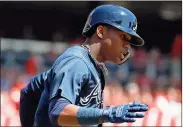  ?? John Minchillo / AP ?? Atlanta’s Ronald Acuna Jr. runs the bases after hitting a solo home run off Cincinnati Reds starting pitcher Homer Bailey in the second inning of Thursday’s game in Cincinnati. Acuna recorded his second major league hit overall and his first home run.