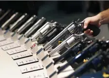  ?? AP ?? SHOT IN THE DARK: The state’s attempt at gun control in 2015 was found to have little effect in a new American University study. Above, a display of handguns is seen at the Smith and Wesson booth at the Shooting, Hunting and Outdoor Trade Show in Las Vegas on Jan. 19, 2016.