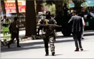  ?? MASSOUD HOSSAINI ?? Security personnel patrol near a park where a would-be attacker was killed in Kabul, Afghanista­n, Monday, July 16.