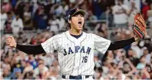  ?? Eric Espada/Getty Images ?? Shohei Ohtani’s strikeout of Mike Trout in the ninth inning Tuesday delivered Japan’s third World Baseball Classic title.