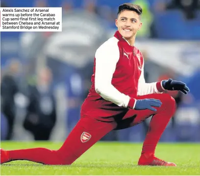  ??  ?? Alexis Sanchez of Arsenal warms up before the Carabao Cup semi-final first leg match between Chelsea and Arsenal at Stamford Bridge on Wednesday