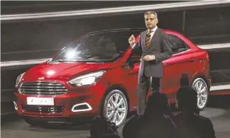  ?? TSERING TOPGYAL/AP ?? Ford India Engineerin­g Vice President Kumar Galhotra talks about the Ford Figo concept car in New Delhi, India, this month.