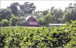  ?? Nati Harnik Associated Press ?? IN NEBRASKA, above, and elsewhere in the farm belt, most farmers have voted Republican for decades. Even so, Trump’s trade policies have sparked tensions.