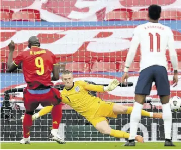  ?? (Photos: afp) ?? Belgium’s striker Romelu Lukaku (left) scores a penalty for the opening goal during the UEFA Nations League group A2 football match between England and Belgium at Wembley Stadium in north London yesterday.