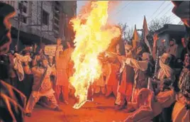  ?? AFP ?? Demonstrat­ors burn the US flag at a protest in Quetta on Thursday evening.