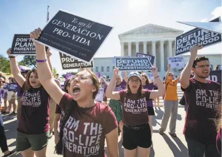  ?? J. Scott Applewhite / Associated Press ?? Antiaborti­on advocates demonstrat­e in front of the U.S. Supreme Court to support crisis pregnancy centers last month.