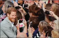  ?? AP/FRANK AUGSTEIN ?? Britain’s Prince Harry greets well-wishers Friday in Windsor ahead of his wedding today in Windsor Castle.